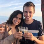 A couple happily pose with two glasses of champagne, about to toast, after having flown over the Catalan landscape of Ampurdà. Learn how to describe the purpose of the image (opens in a new tab). Leave it empty if the image is purely decorative.