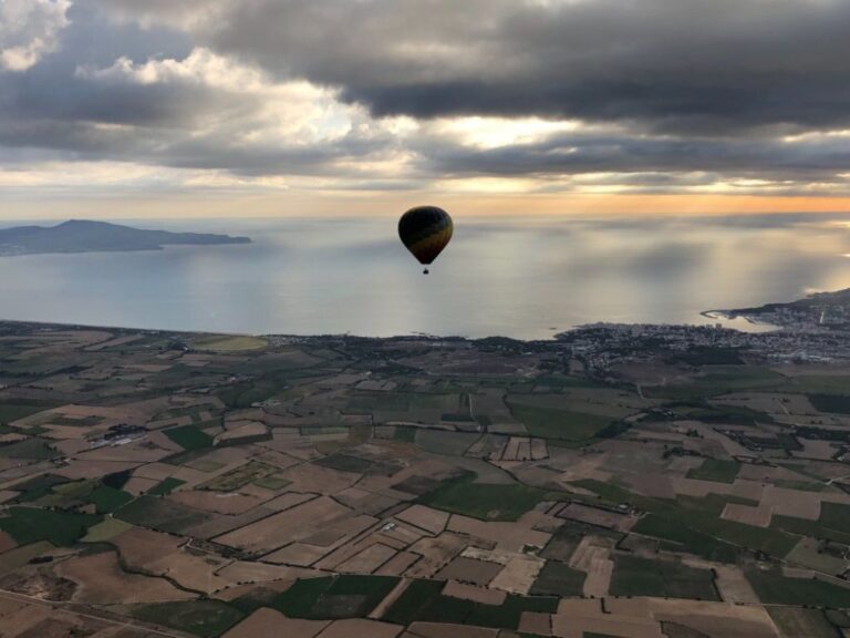 Hot air balloon flying over the Catalan landscape of Empordà. Learn how to describe the purpose of the image (opens in a new tab). Leave it empty if the image is purely decorative.