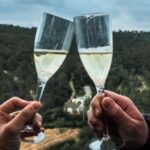 Two people enjoying a glass of Cava, toasting, after having flown in a hot air balloon from Girona to Figueres. Learn how to describe the purpose of the image (opens in a new tab). Leave it empty if the image is purely decorative.