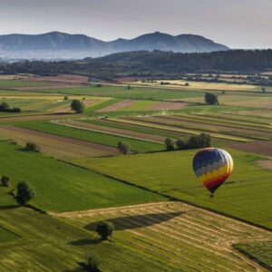 Balloon landing on a green field in Colomer, Girona.