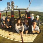 A group flies over Empordà enjoying the views while taking a photo in the air.