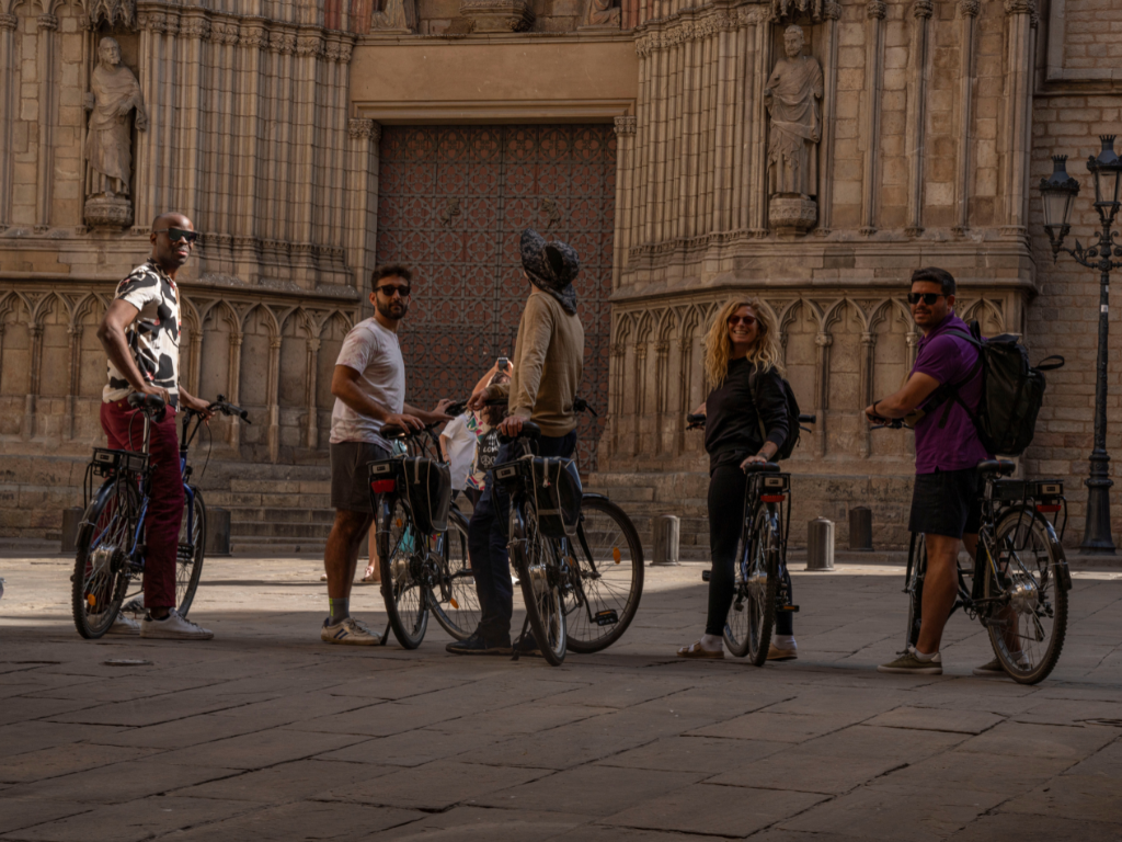 Group posing in front of Barcelona Cathedral, looking at the camera.