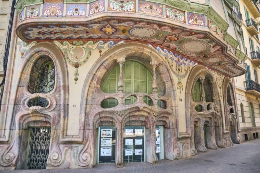 Modernist façade with ornate balconies in Barcelona.